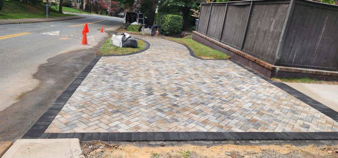 Herringbone paver driveway apron with charcoal border