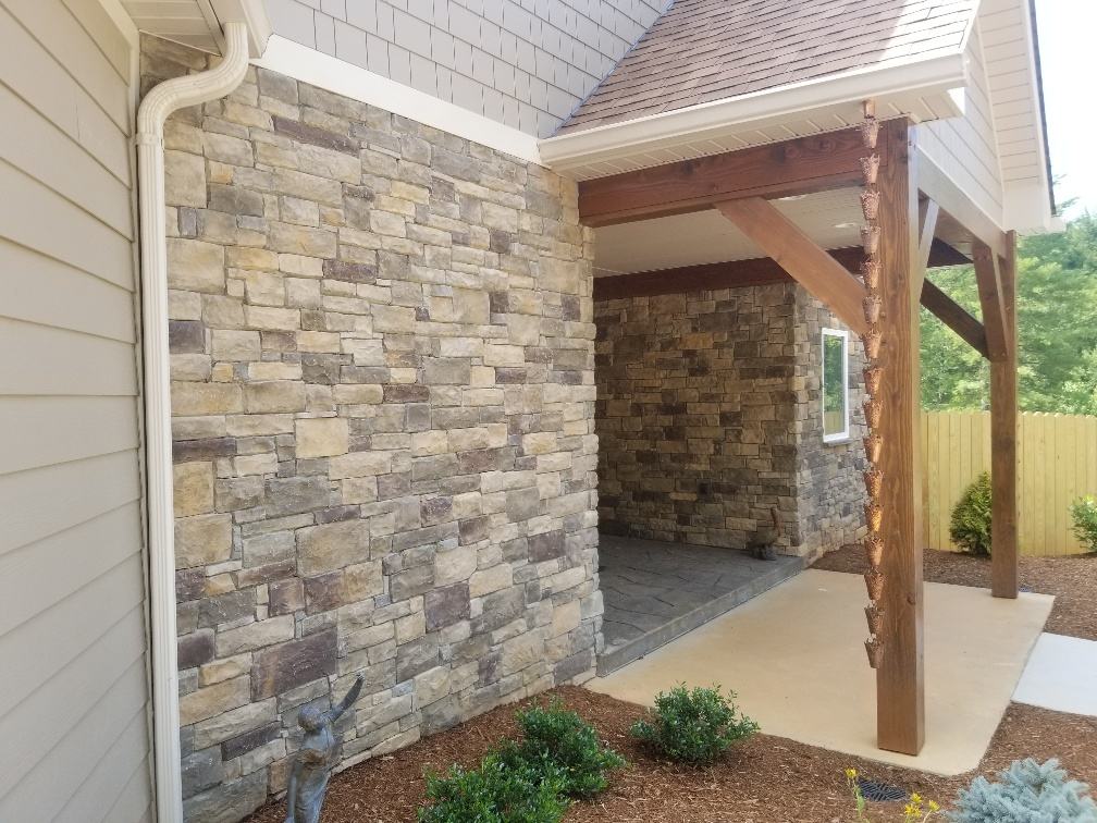 Stone veneer walls under a timber-framed covered porch