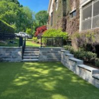 Outdoor lighting on steps and underneath wall caps