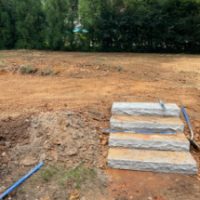 Stone steppers between green and firepit