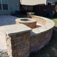 firepit with seating wall hardscaping Landmark AOS Charlotte NC